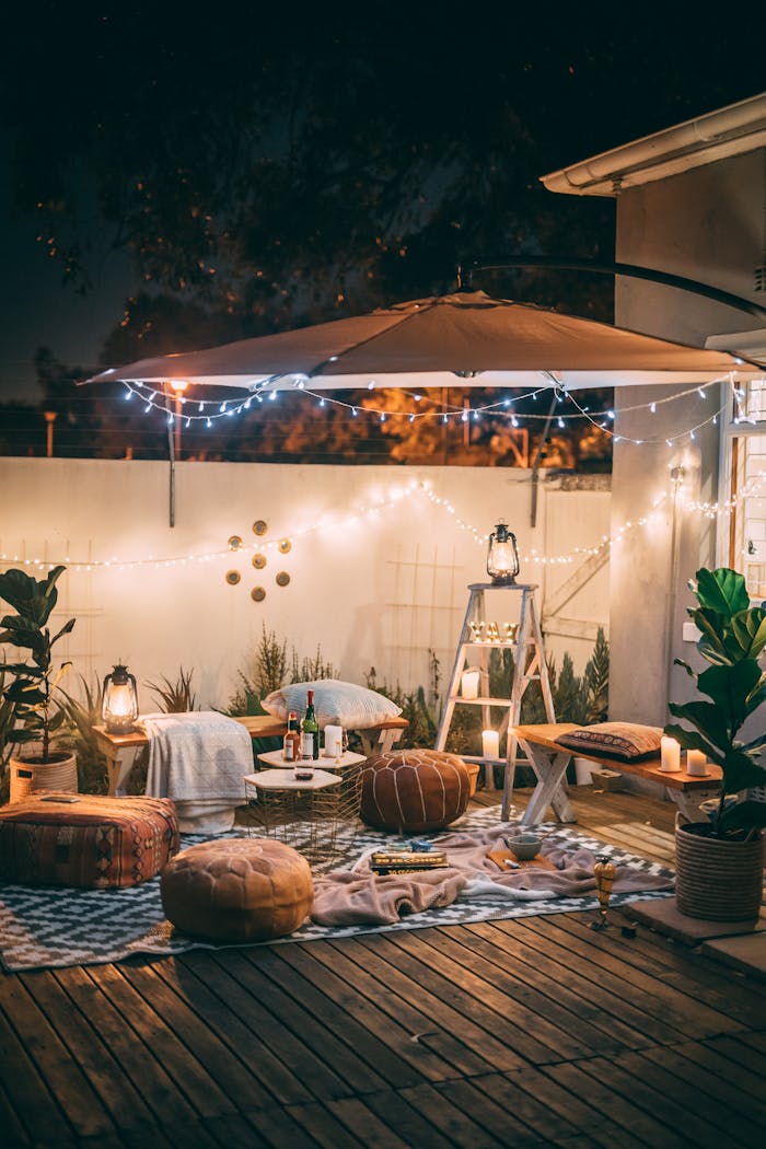 Mastering the First Impression: Your intriguing post title goes here Charming outdoor patio scene with cozy seating and warm lighting at night.