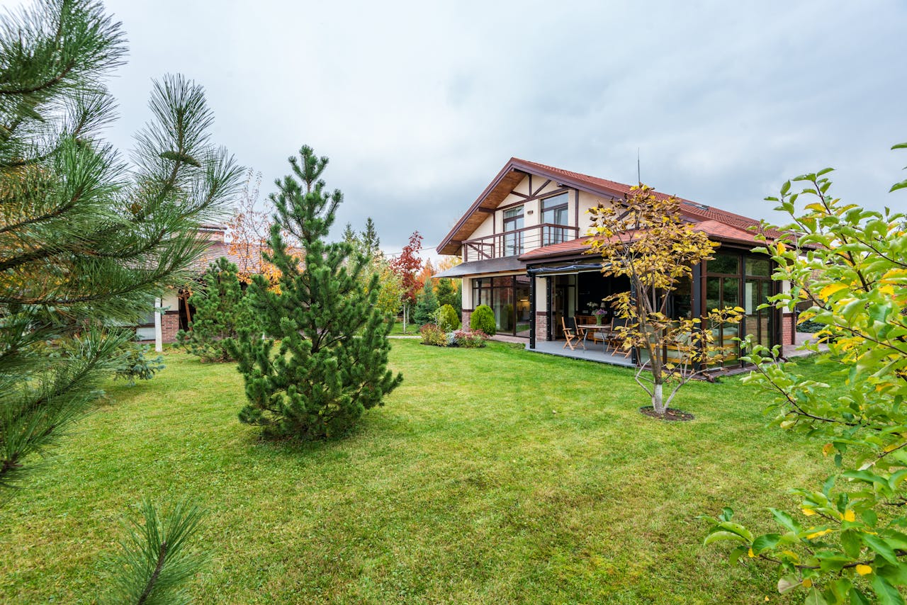 Home Charming suburban residence with lush greenery and a spacious yard, ideal for a tranquil lifestyle.